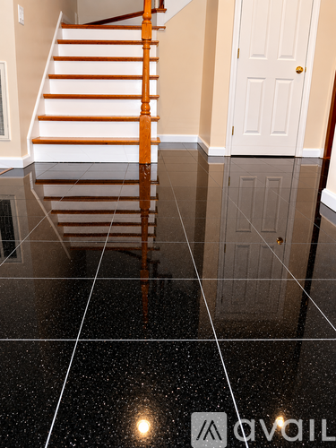A staircase with a white and orange railing.