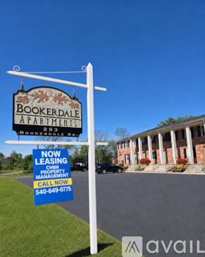 A sign for Bookerdale Apartments is displayed in front of a building.