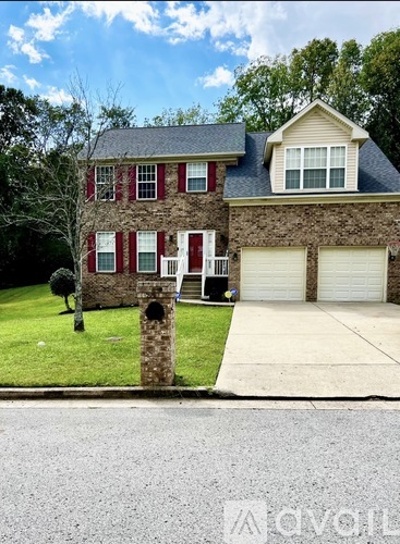 A house with a red and white front door is for sale.