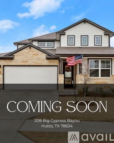 A house with a sign that says "COMING SOON" is located at 208 Big Cypress Bayou, Hutto, TX 78634.