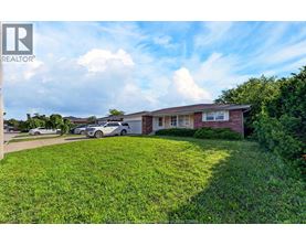A house with a lawn in front of it is for sale.
