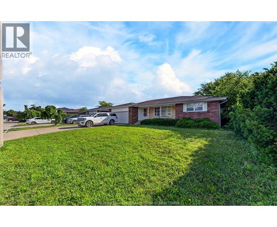 A house with a lawn in front of it is for sale.