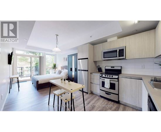 A modern kitchen with a dining table and chairs.