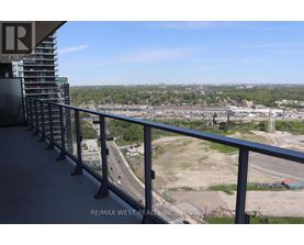 A balcony with a view of a highway and a construction site.