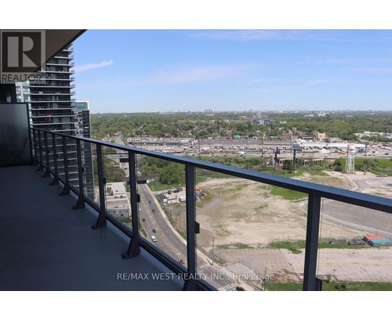 A balcony with a view of a highway and a construction site.