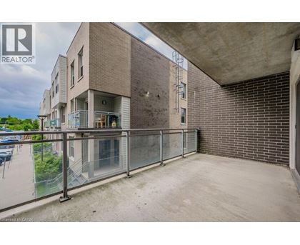 A building with a balcony and a glass railing.