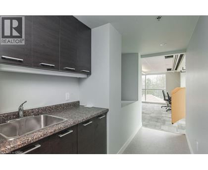 A kitchen with a sink and cabinets.