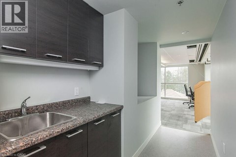 A kitchen with a sink and cabinets.