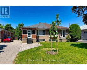 A house with a tree in front of it is for sale.
