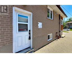 A house with a white door and a sign that says REMAX YC REALTOR Brokerage.