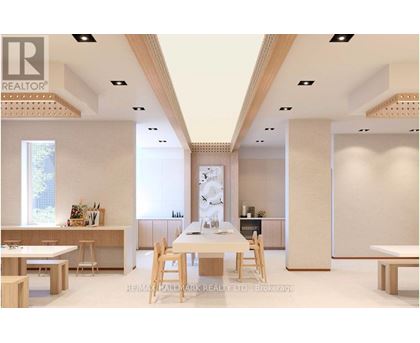 A modern dining room with a white table and chairs.