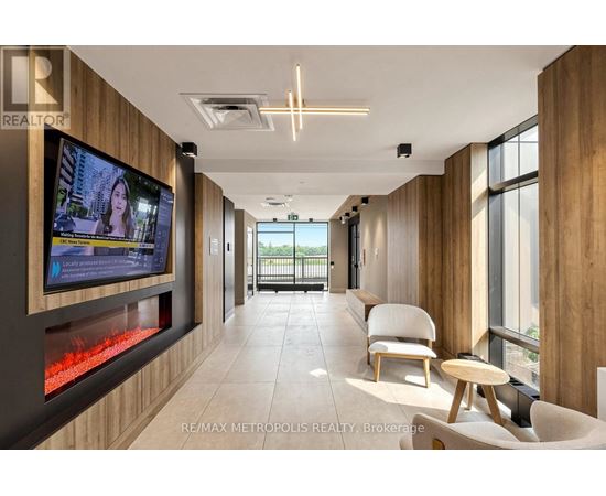 A modern living room with a flat screen TV mounted on the wall.