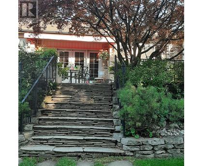 A set of stone steps lead up to a house.