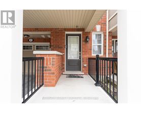 A black door with a glass window is on the right side of the image.
