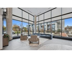 A modern living room with a large window overlooking a cityscape.
