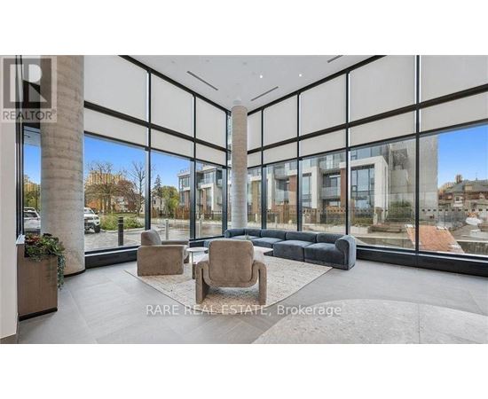 A modern living room with a large window overlooking a cityscape.