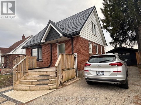 A house with a car parked in front of it.