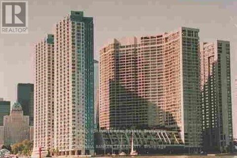 A cityscape with skyscrapers and a bridge in the background.
