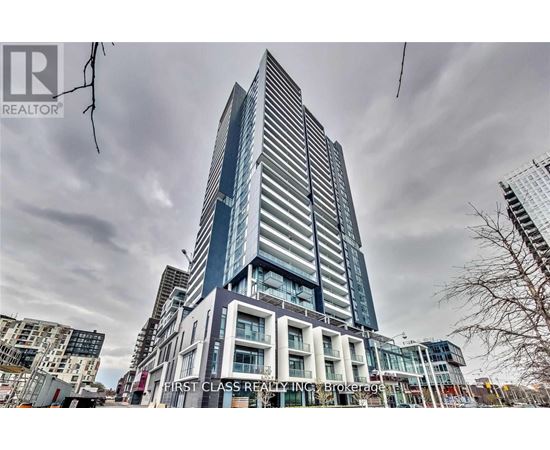 A tall building with a glass facade is under construction.