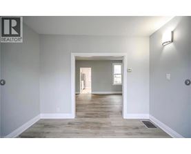 A realtor logo is on the wall of a room.