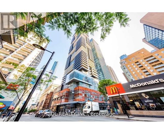 A tall building with a McDonald's restaurant in front of it.