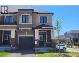A two-story house with a garage and a balcony on the second floor.