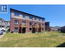A multi-story building with a balcony is for sale.