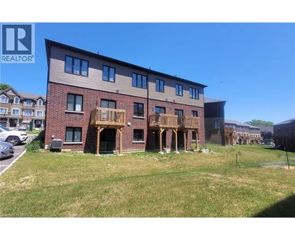 A multi-story building with a balcony is for sale.