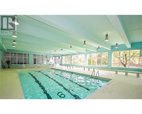 A large indoor swimming pool with the number 6 on the side.