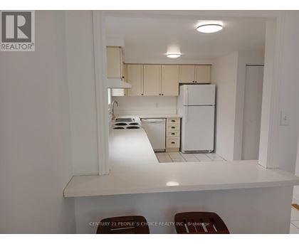 A bedroom with a bed and a door.