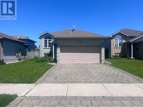 A house with a garage is for sale by Streetcity Realty.