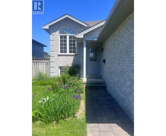 A house with a grey front door and a small porch.