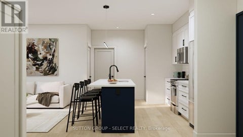 A modern kitchen with a dining table and chairs.