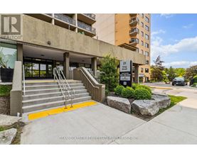 A building with a glass door entrance and a sign that says "REALTOR".