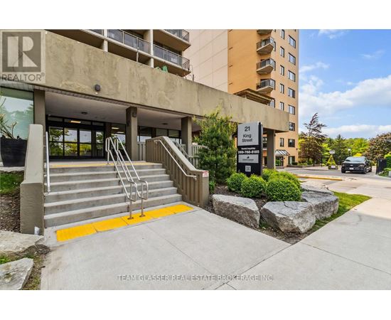 A building with a glass door entrance and a sign that says "REALTOR".