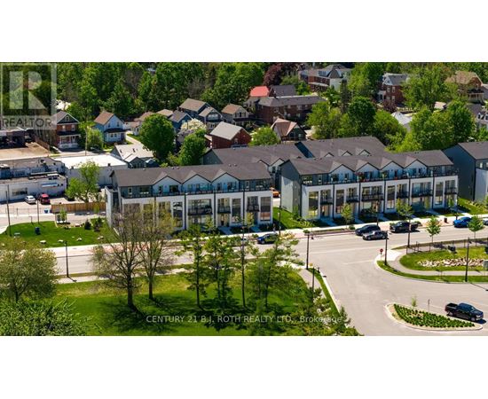 A real estate company's office building with a parking lot in front.