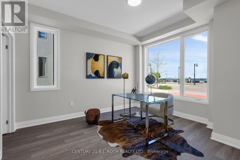 A modern living room with a glass coffee table and a cowhide rug.