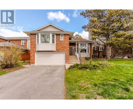 A house with a garage is for sale.