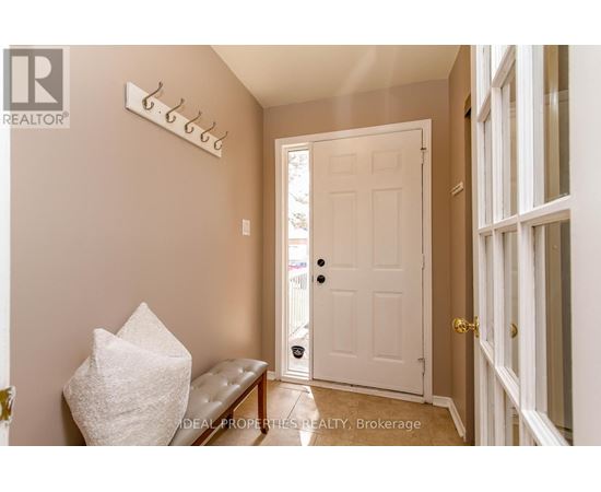 A white door is open to a hallway.