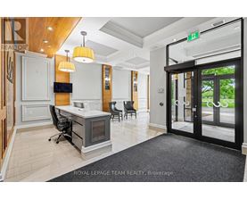 A brokerage office with a desk and chairs.