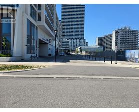 A street view with buildings and a sign that says REALTOR.