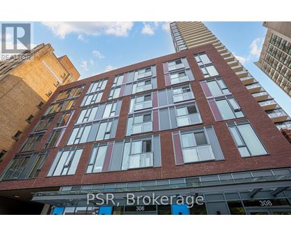 A tall red brick building with the words PSR Brokerage on the front.