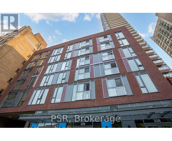 A tall red brick building with the words PSR Brokerage on the front.