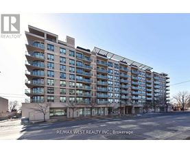 A large apartment building with the RE/MAX West Realty Inc. logo on the top left corner.