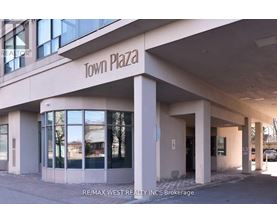 A building with the words "Town Plaza" on the front.