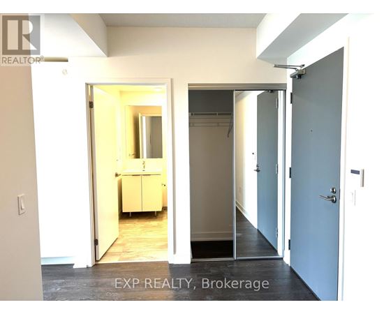 A room with a doorway leading to another room.