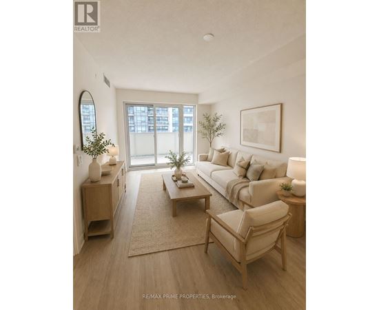 A well-lit living room with a couch, chair, and coffee table.