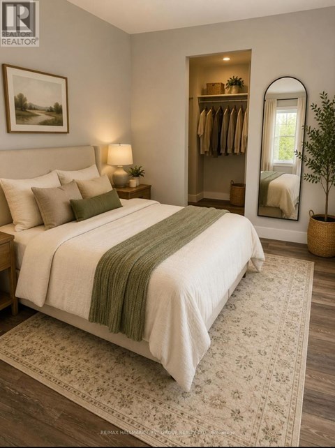 A bedroom with a large bed and a mirror on the wall.