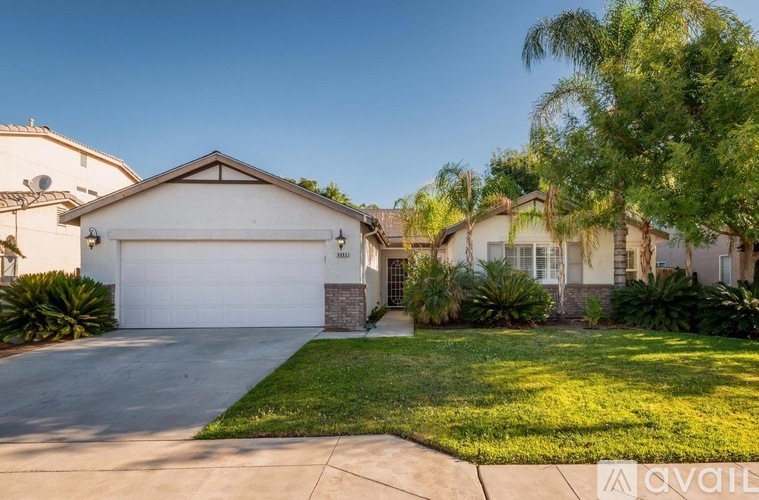 A house with a white garage door is for sale.