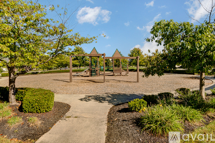 A playground with a swing set and a slide.